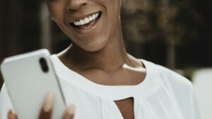 Happy black woman on her phone